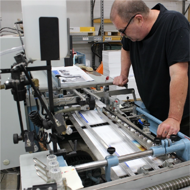 Press operator monitoring commercial print run