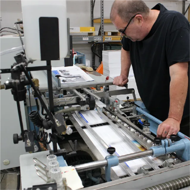 Press operator monitoring commercial print run